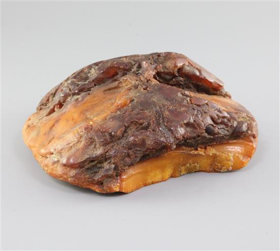 A large piece of raw amber, gross weight 1084 grams, approx. 7in by 7in by 3in.